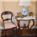 F13. Pair of Victorian balloon-back chairs with pink upholdered seats and marble top Eastlake side table, 